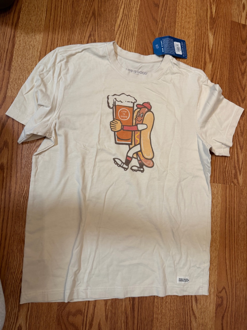 Life Is Good Cream Graphic Tee with Orange & Brown Hot Dog Design